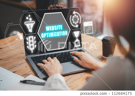 Website optimizaation concept, Business woman using on laptop computer on desk with website optimizaation icon on virtual screen. Website optimizaation concept, Business woman using on laptop computer on desk with website optimizaation icon on virtual screen. 112684173