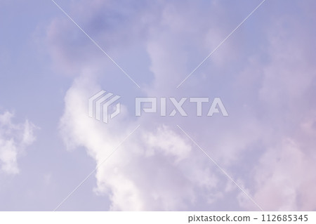 Background of a beautiful pink and pale purple sky with clouds at sunset. High quality photo 112685345