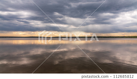 Blue lake with cloudy sky, natural background Blue lake with cloudy sky, natural background 112685812