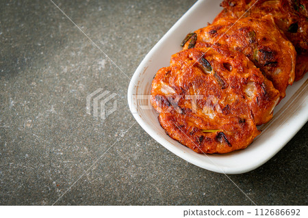 Korean Kimchi pancake or Kimchijeon - Fried Mixed Egg, Kimchi, and Flour Korean Kimchi pancake or Kimchijeon - Fried Mixed Egg, Kimchi, and Flour 112686692