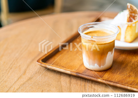 Dirty Coffee - A glass of espresso shot mixed with cold fresh milk Dirty Coffee - A glass of espresso shot mixed with cold fresh milk 112686919