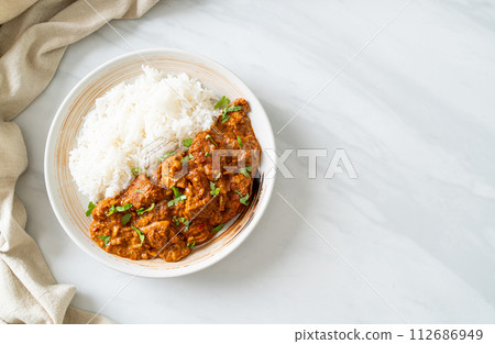 chicken tikka masala with rice on plate chicken tikka masala with rice on plate 112686949
