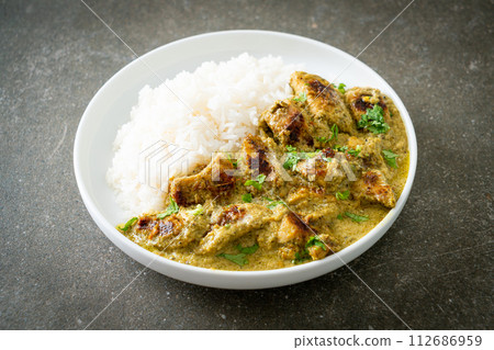 Afghani chicken in green curry or Hariyali tikka chicken hara masala with rice Afghani chicken in green curry or Hariyali tikka chicken hara masala with rice 112686959