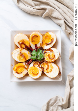 Fried Boiled Egg with Tamarind Sauce Fried Boiled Egg with Tamarind Sauce 112686962