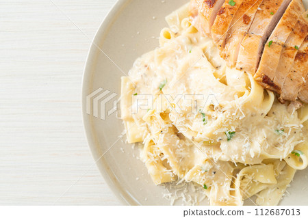 fettucine pasta white creamy sauce with grilled chicken fettucine pasta white creamy sauce with grilled chicken 112687013