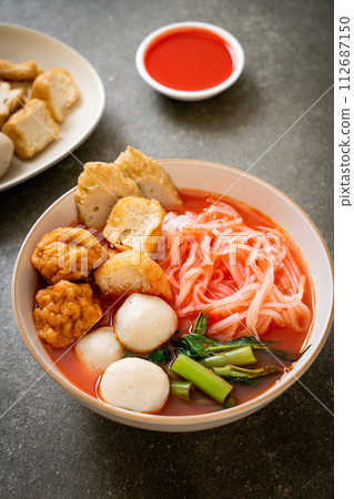 small flat rice noodles with fish balls and shrimp balls in pink soup, Yen Ta Four or Yen Ta Fo 112687150