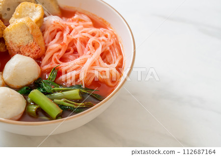 small flat rice noodles with fish balls and shrimp balls in pink soup, Yen Ta Four or Yen Ta Fo 112687164