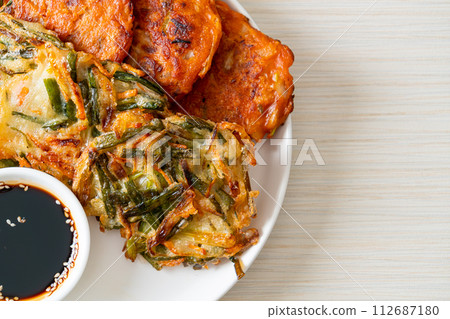 Pajeon or Korean pancake and Korean Kimchi pancake or Kimchijeon on white background 112687180