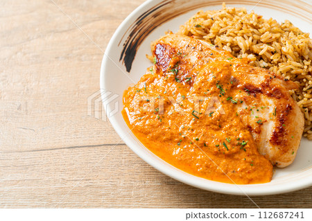 grilled chicken steak with red curry sauce and rice 112687241