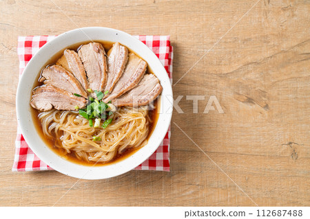 duck noodles with stewed duck soup 112687488