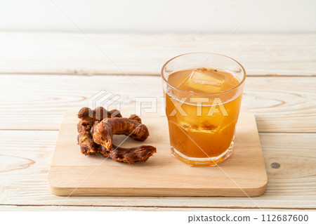 Delicious sweet drink tamarind juice and ice cube Delicious sweet drink tamarind juice and ice cube 112687600
