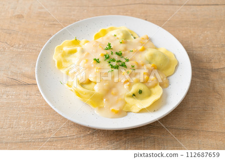 ravioli pasta with corn cheese sauce 112687659