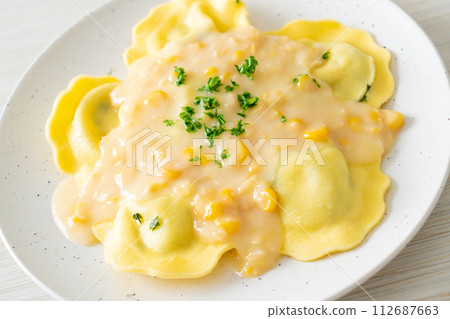 ravioli pasta with corn cheese sauce 112687663