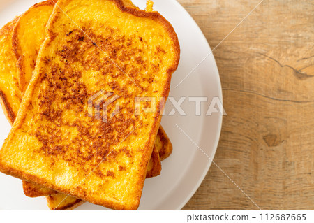 french toast on white plate 112687665