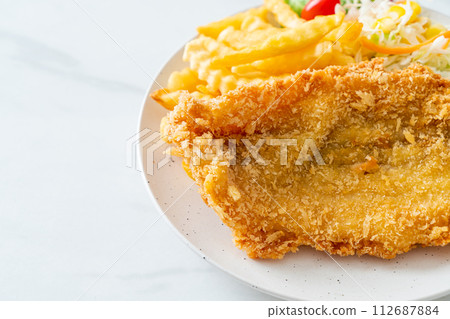 fried fish and potatoes chips 112687884