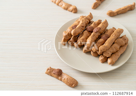 chocolate meringue stick on plate 112687914