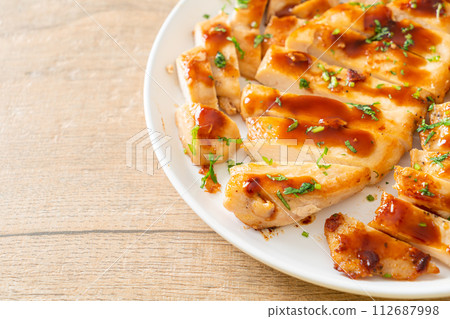 grilled chicken breast sliced on plate grilled chicken breast sliced on plate 112687998