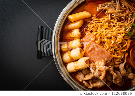 Budae Jjigae or Budaejjigae (Army stew or Army base stew). It is loaded with Kimchi, spam, sausages, ramen noodles and much more Budae Jjigae or Budaejjigae (Army stew or Army base stew). It is loaded with Kimchi, spam, sausages, ramen noodles and much more 112688059