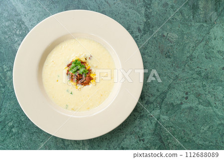 corn soup with crispy bacon 112688089