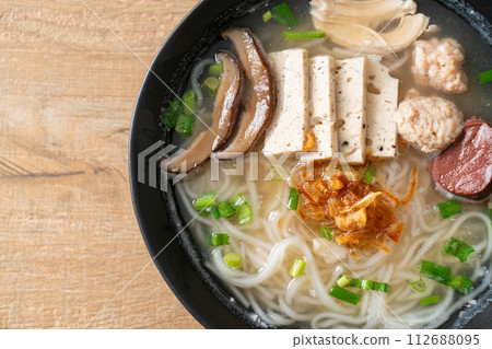 Vietnamese Rice Noodles Soup with Vietnamese Sausage served vegetables and crispy onion Vietnamese Rice Noodles Soup with Vietnamese Sausage served vegetables and crispy onion 112688095