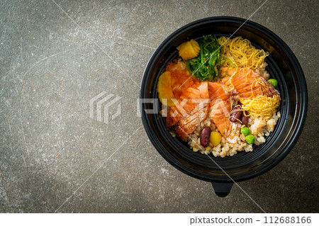 grilled salmon with brown rice donburi 112688166