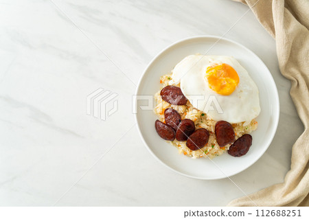 fried rice with fried egg and Chinese sausage 112688251