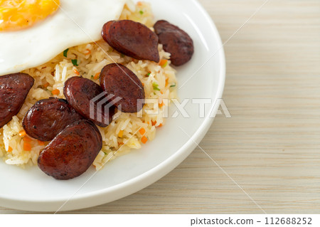 fried rice with fried egg and Chinese sausage 112688252