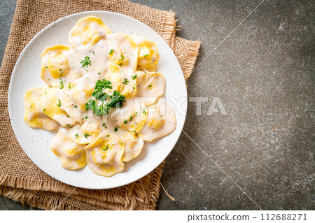 ravioli pasta with mushroom cream sauce and cheese ravioli pasta with mushroom cream sauce and cheese 112688271