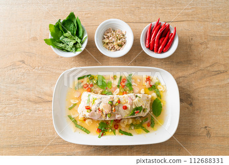 steamed sea bass fish with herbs steamed sea bass fish with herbs 112688331