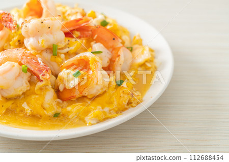 creamy omelet with shrimps or scrambled eggs and shrimps 112688454