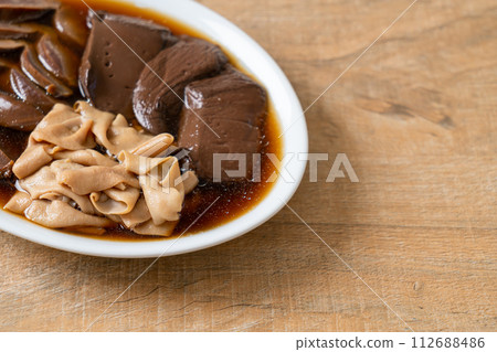 stewed duck offal in brown soup stewed duck offal in brown soup 112688486