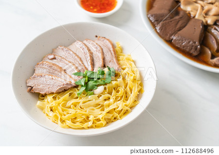 dried duck noodles in white bowl 112688496
