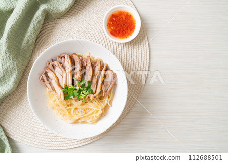 dried noodles with stewed duck in white bowl dried noodles with stewed duck in white bowl 112688501