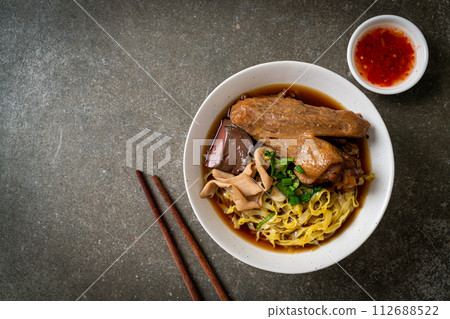 egg noodles with stewed and braised duck in brown soup egg noodles with stewed and braised duck in brown soup 112688522