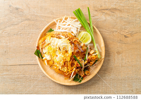 Pad Thai - stir fried noodles in Thai style with egg 112688588
