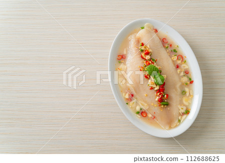 Steamed Fish in Spicy Lemon Sauce Steamed Fish in Spicy Lemon Sauce 112688625