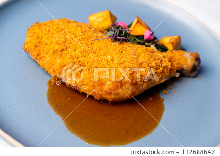 fried chicken thigh with vegetable and sauce fried chicken thigh with vegetable and sauce 112688647