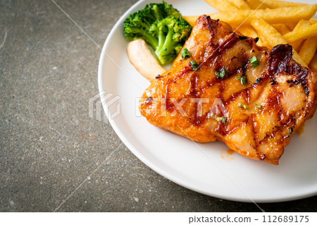 grilled chicken steak with potato chips or french fries grilled chicken steak with potato chips or french fries 112689175