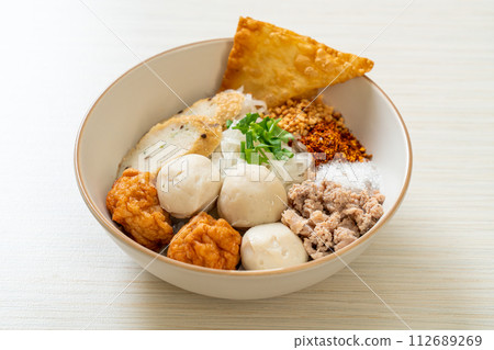 spicy small flat rice noodles with fish balls and shrimp balls without soup 112689269