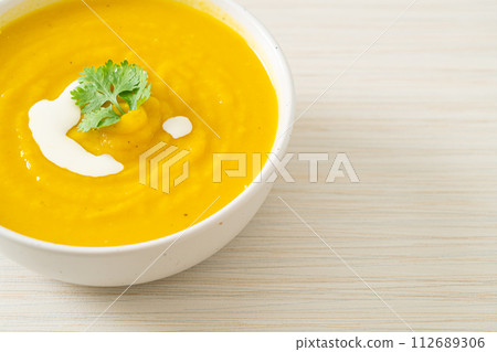 pumpkin soup in white bowl 112689306