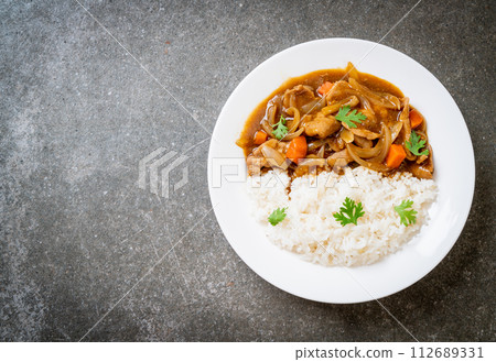 Japanese curry rice with sliced pork, carrot and onions Japanese curry rice with sliced pork, carrot and onions 112689331