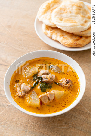 Chicken curry soup with roti Chicken curry soup with roti 112689375