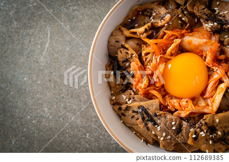 pork bulgogi rice bowl with kimchi and Korean pickled egg 112689385