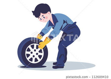 Male worker changing a tire Male worker changing a tire 112689410