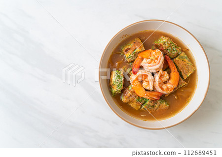 Sour soup made of Tamarind Paste with Shrimps and Vegetable Omelet Sour soup made of Tamarind Paste with Shrimps and Vegetable Omelet 112689451