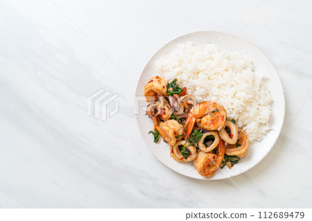 rice and stir-fried seafood with Thai basil rice and stir-fried seafood with Thai basil 112689479