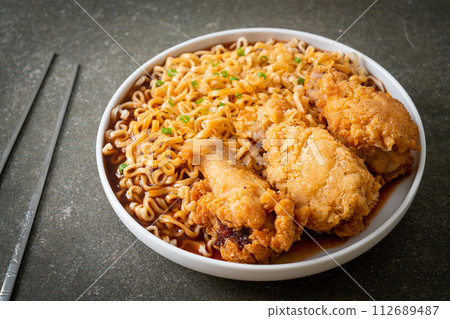 Korean instant noodles with fried chicken or Fried chicken ramyeon Korean instant noodles with fried chicken or Fried chicken ramyeon 112689487