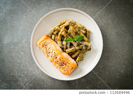 pesto quadrotto penne pasta with grilled salmon 112689496