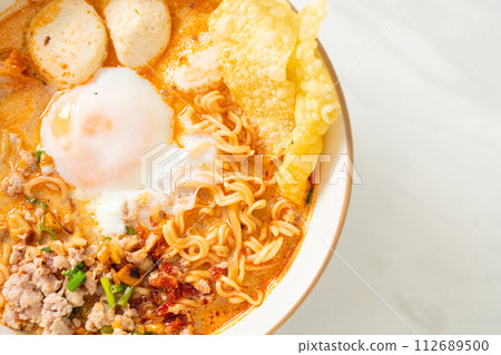 instant noodles with pork and meatballs in spicy soup instant noodles with pork and meatballs in spicy soup 112689500