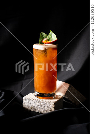 cocktail - infused tequila with basil, passion fruit and cinnamon, lime and mango 112689516